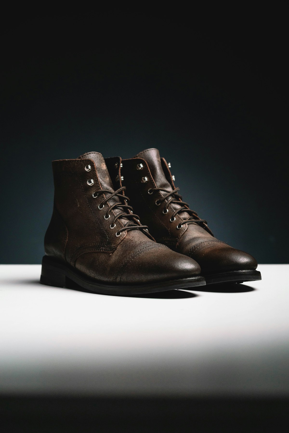 Dark brown leather lace-up boots