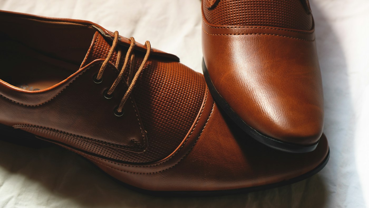 Polished brown leather dress shoes