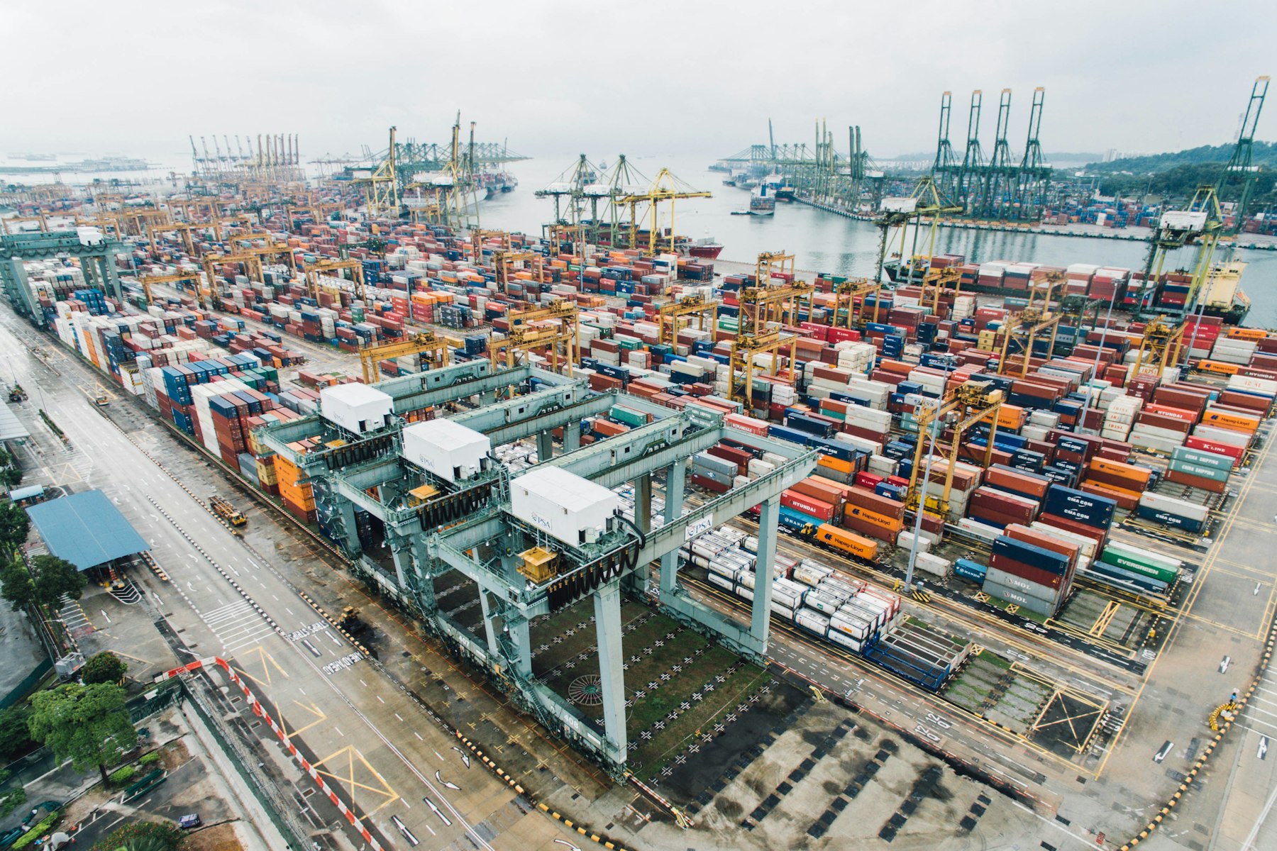 Aerial view of a container terminal with stacked shipping containers
